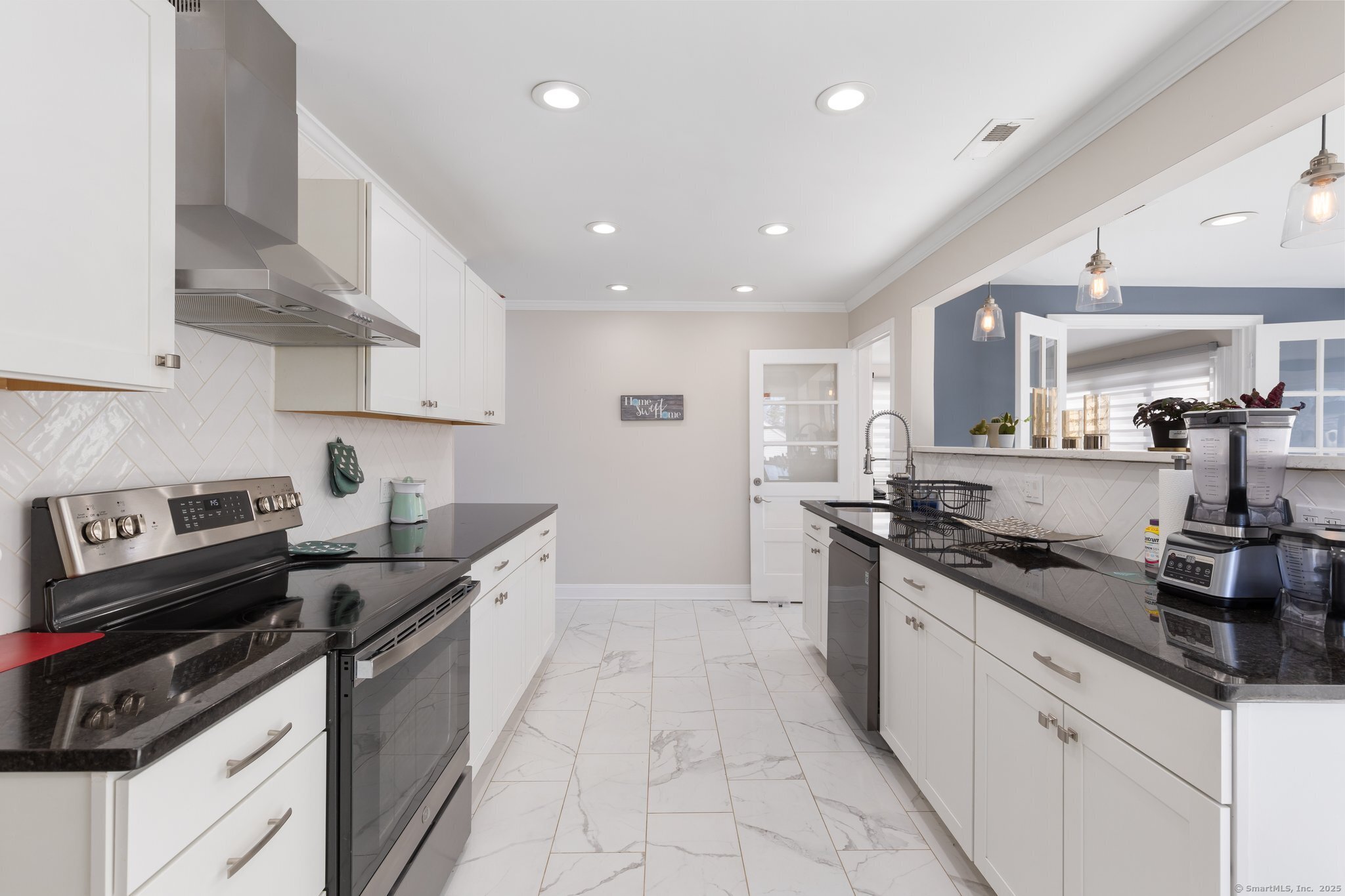 95 Training Hill Road Middletown, CT 06457 - Photo 20 of 33 a kitchen with granite countertop a sink stove and cabinets