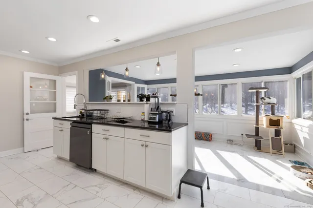 a kitchen with stainless steel appliances granite countertop a sink and cabinets