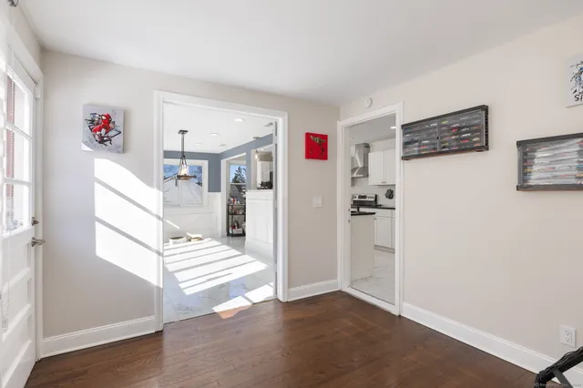 a view of entryway with stairs and wooden floor