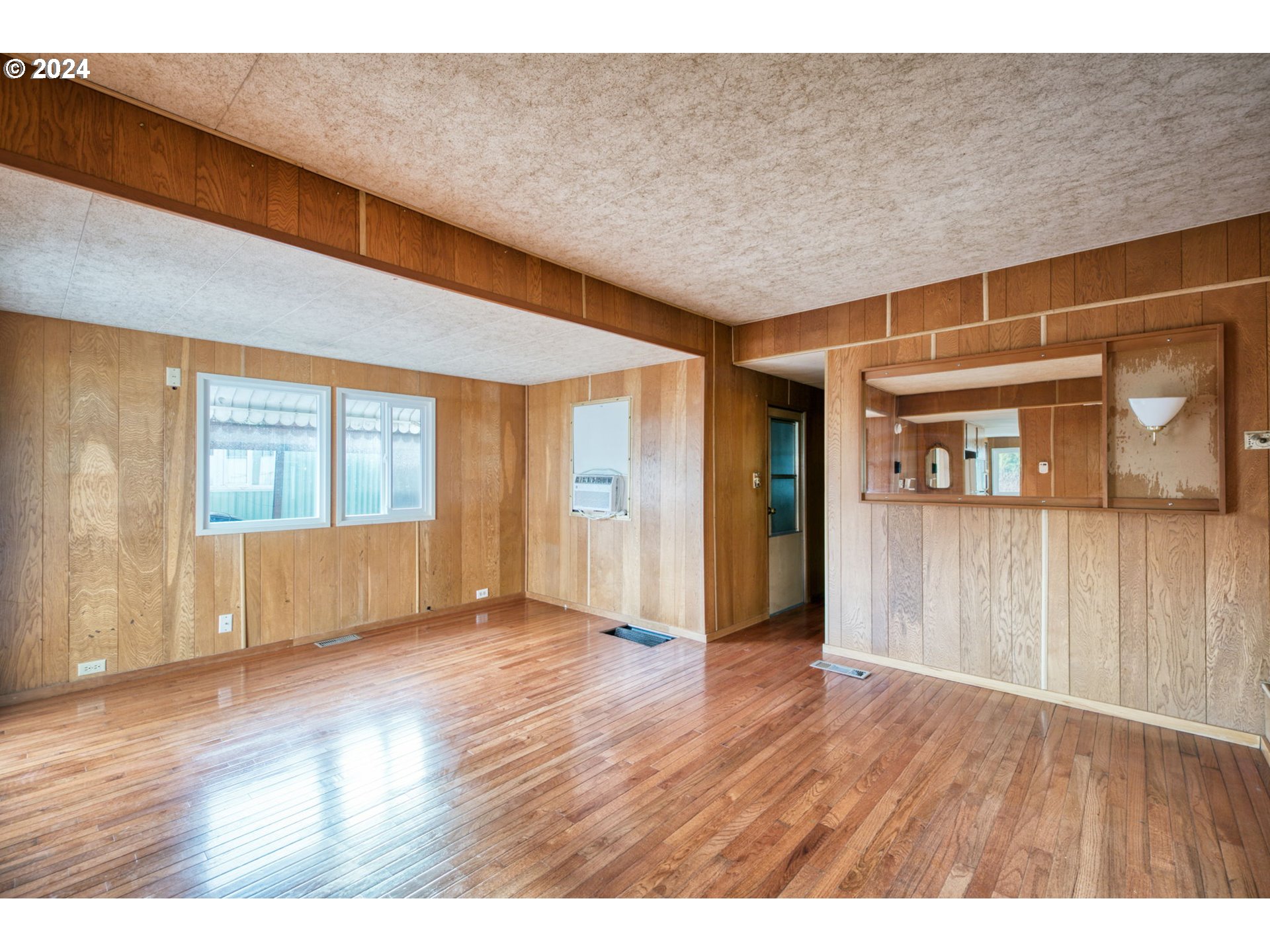 1625 Henderson Avenue Eugene, OR 97403 - Photo 11 of 20 a view of an empty room with wooden floor and a window