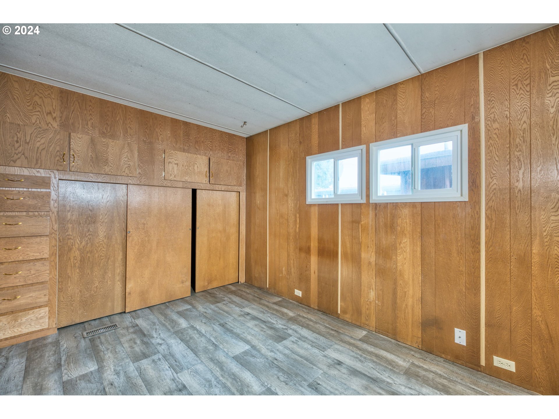 1625 Henderson Avenue Eugene, OR 97403 - Photo 14 of 20 a view of an empty room with wooden floor