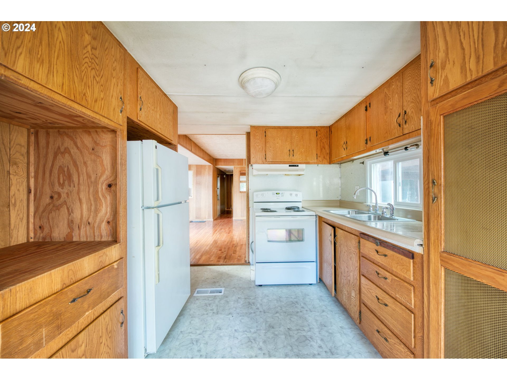 1625 Henderson Avenue Eugene, OR 97403 - Photo 7 of 20 a kitchen with stainless steel appliances granite countertop a refrigerator and a stove top oven