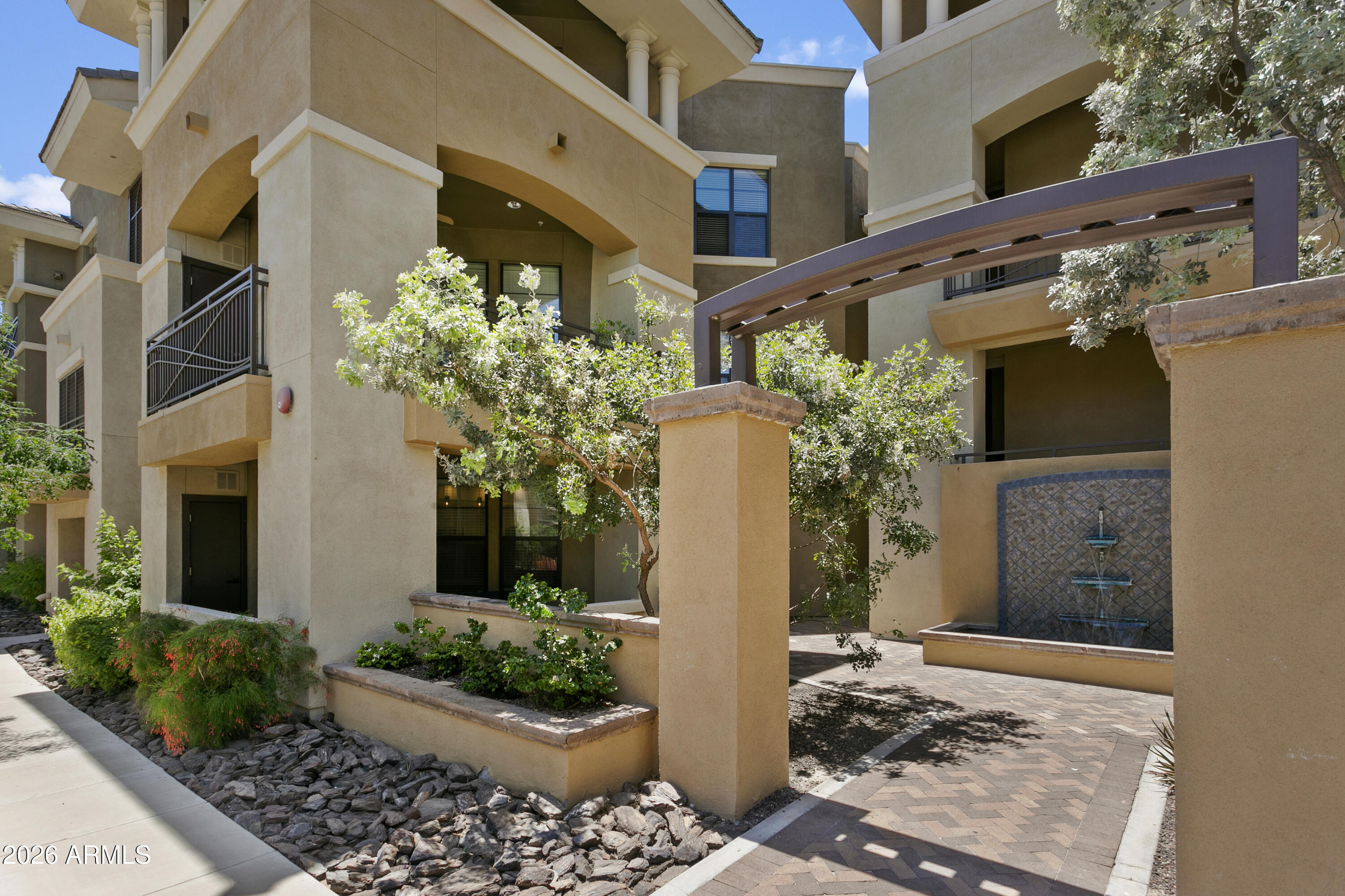 7601 East Indian Bend Road, Unit 1017 Scottsdale, AZ 85250 - Photo 38 of 49 a front view of a house with a yard