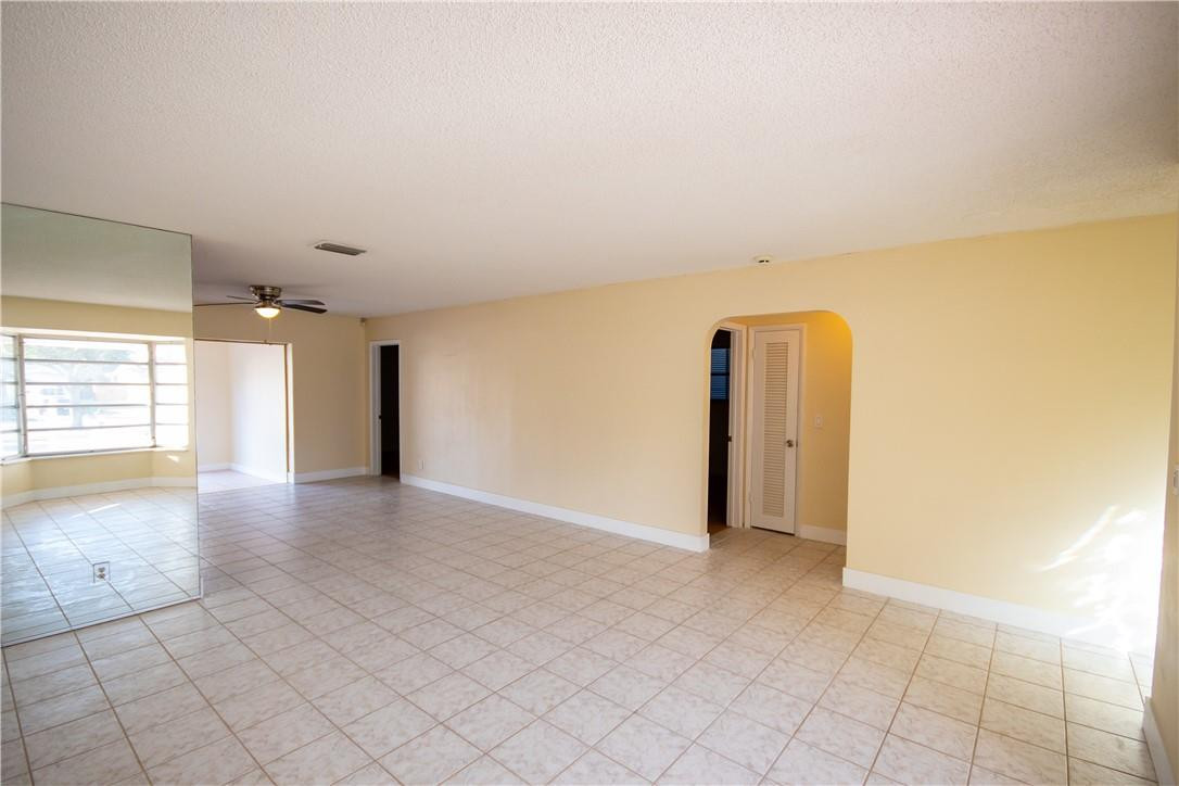 5409 West Park Road Hollywood, FL 33021 - Photo 7 of 64 an empty room with windows and painted walls
