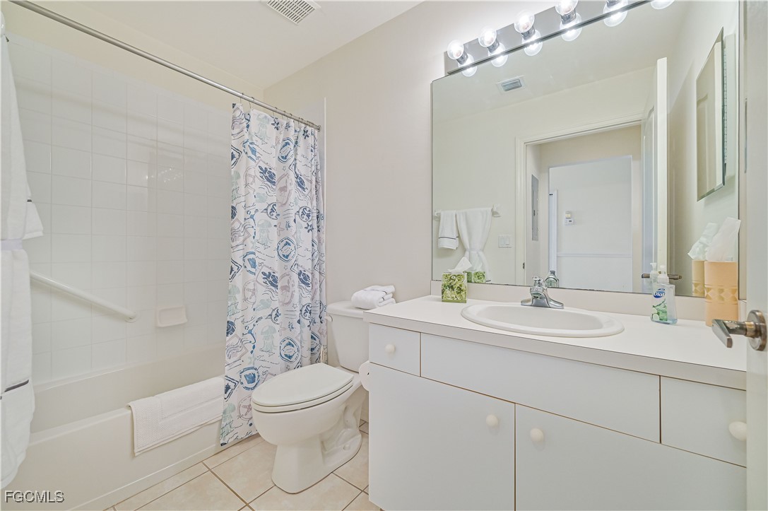 14121 Brant Point Circle, Unit 1202 Fort Myers, FL 33919 - Photo 23 of 47 a bathroom with a sink a toilet and shower