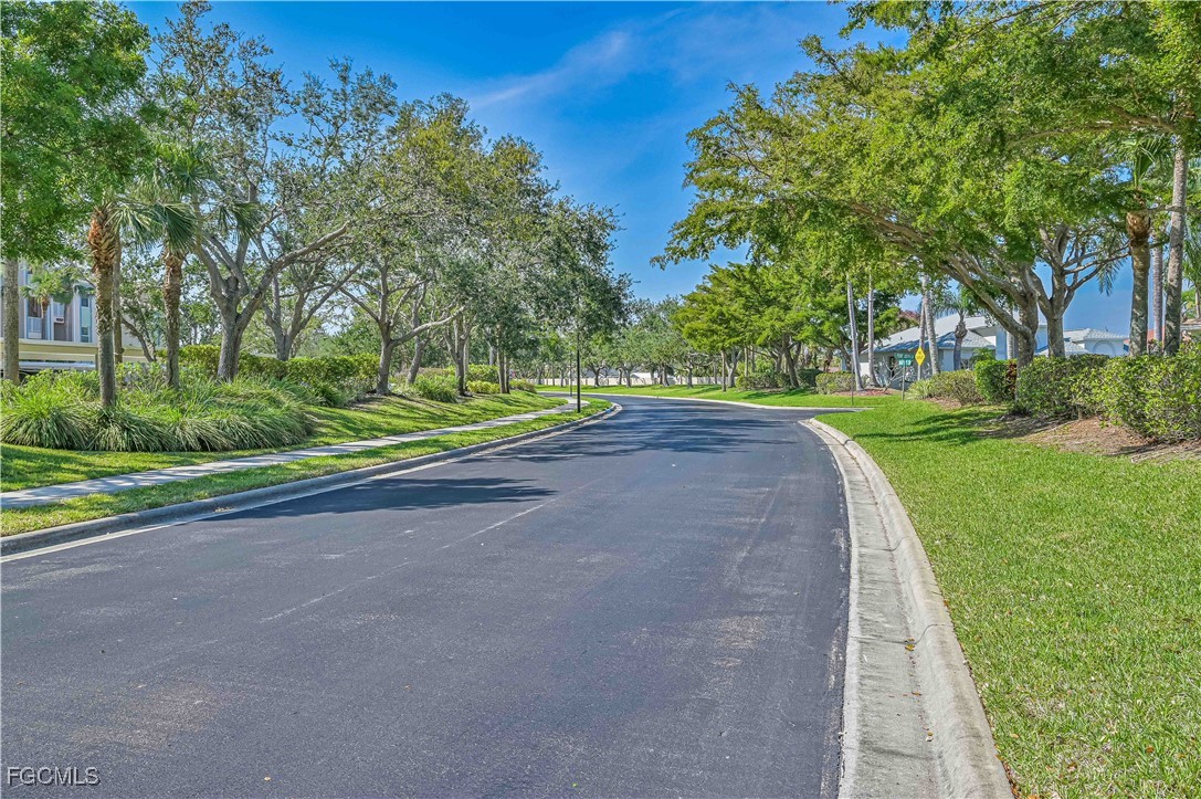 14121 Brant Point Circle, Unit 1202 Fort Myers, FL 33919 - Photo 30 of 47 a view of a road with a big yard