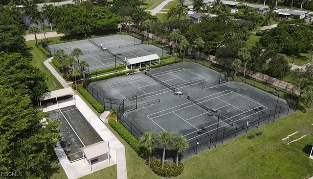 a view of a park with lounge chairs