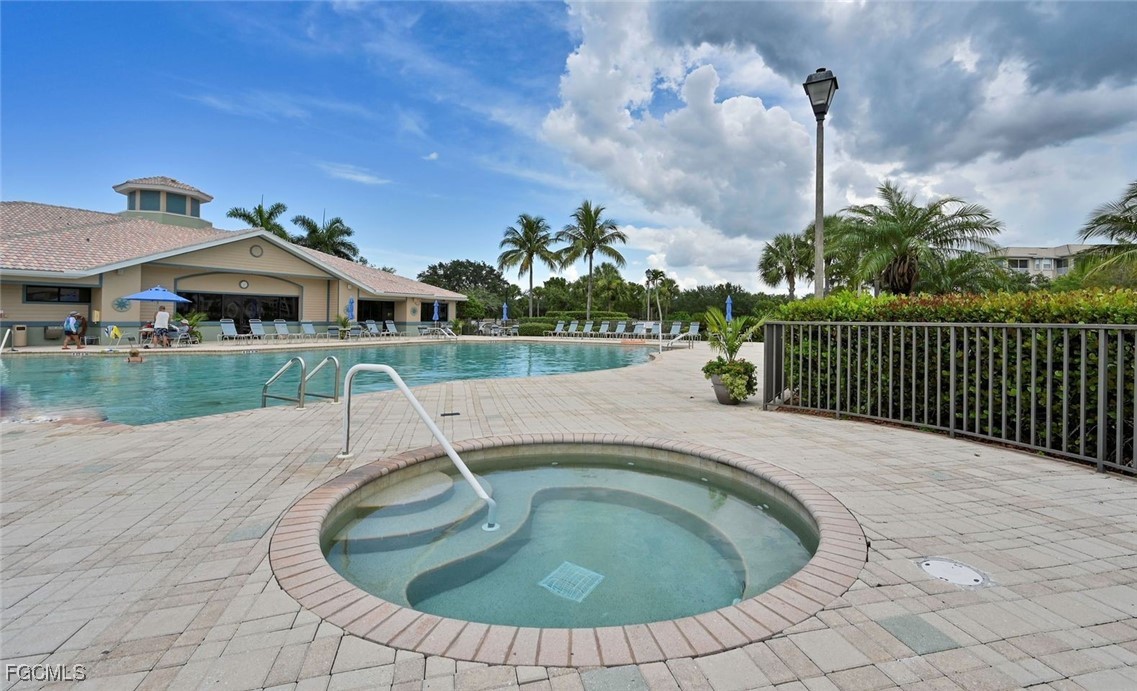 14121 Brant Point Circle, Unit 1202 Fort Myers, FL 33919 - Photo 44 of 47 a swimming pool with outdoor seating yard and barbeque oven