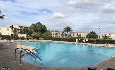 14121 Brant Point Circle, Unit 1202 Fort Myers, FL 33919 - Photo 45 of 47 a view of a swimming pool and lake view