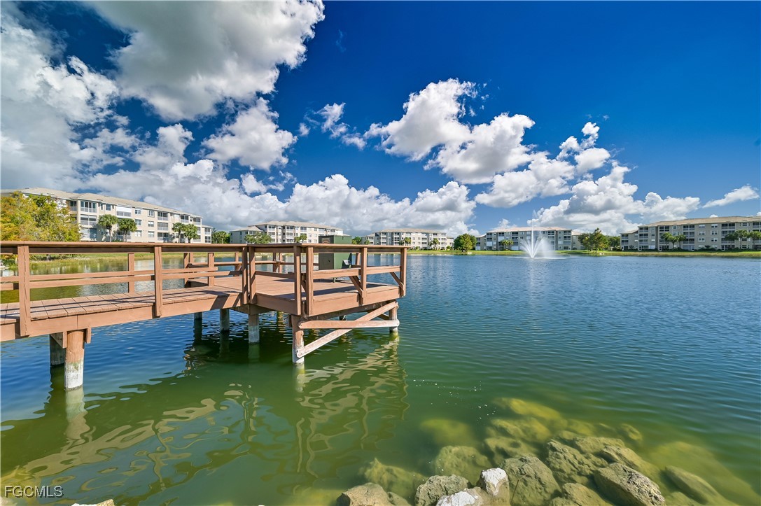 14121 Brant Point Circle, Unit 1202 Fort Myers, FL 33919 - Photo 47 of 47 a view of a lake with houses in the back