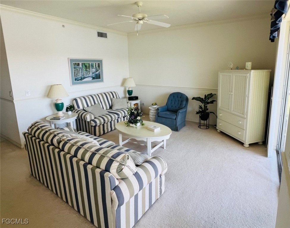 14121 Brant Point Circle, Unit 1202 Fort Myers, FL 33919 - Photo 7 of 47 a bedroom with a bed and a chandelier
