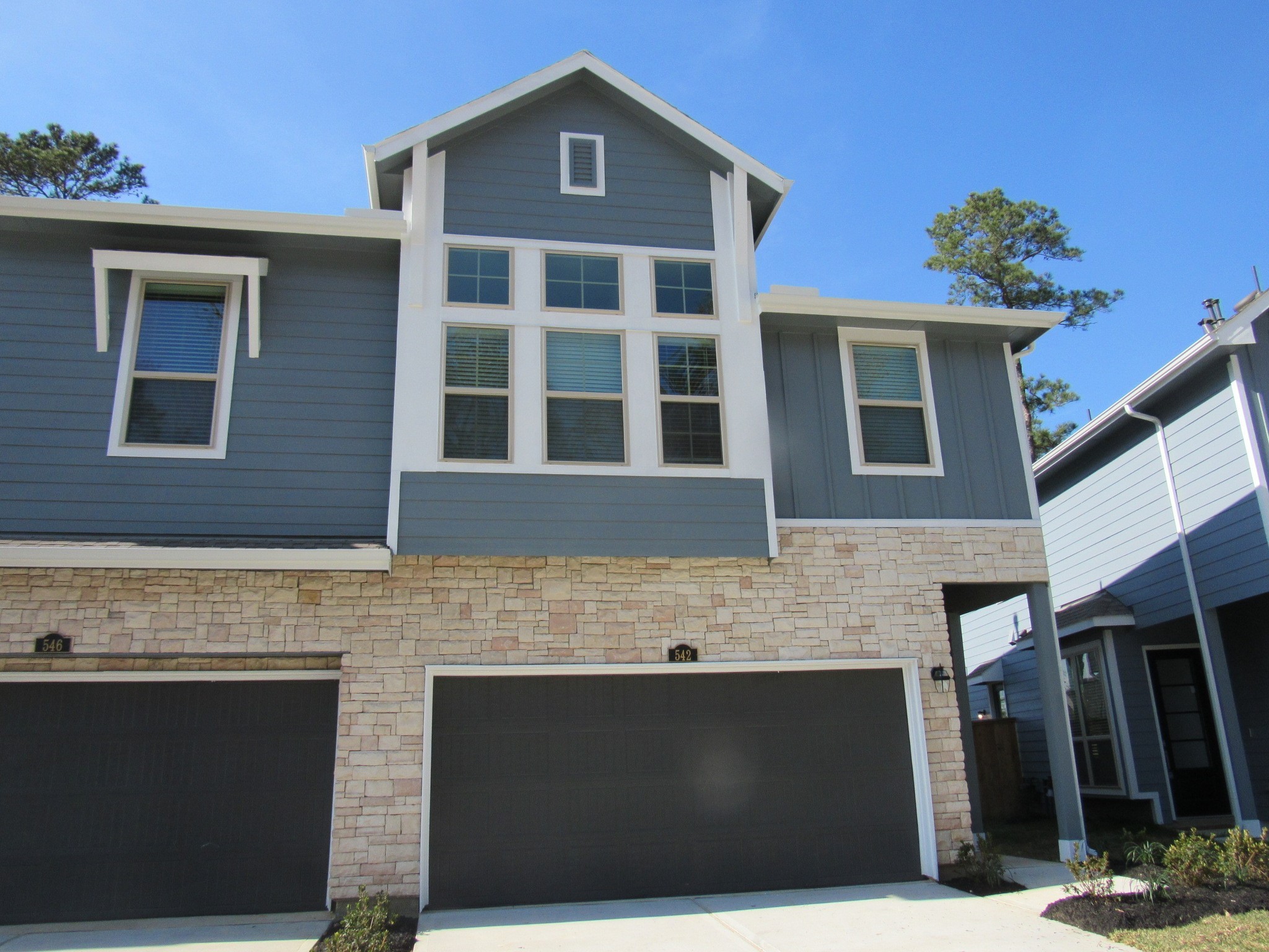 542 Dry Fork Lane Conroe, TX 77304 - Photo 1 of 9 a front view of a house with a yard