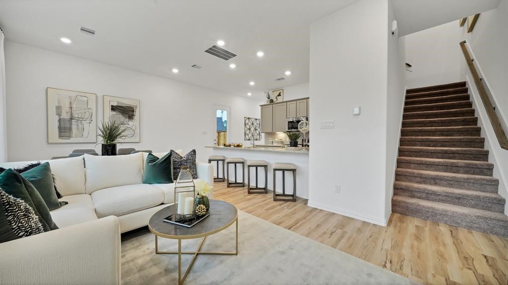 542 Dry Fork Lane Conroe, TX 77304 - Photo 5 of 9 a living room with furniture and wooden floor