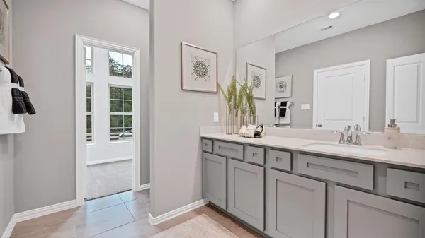 a bed room with a bed and a night stand