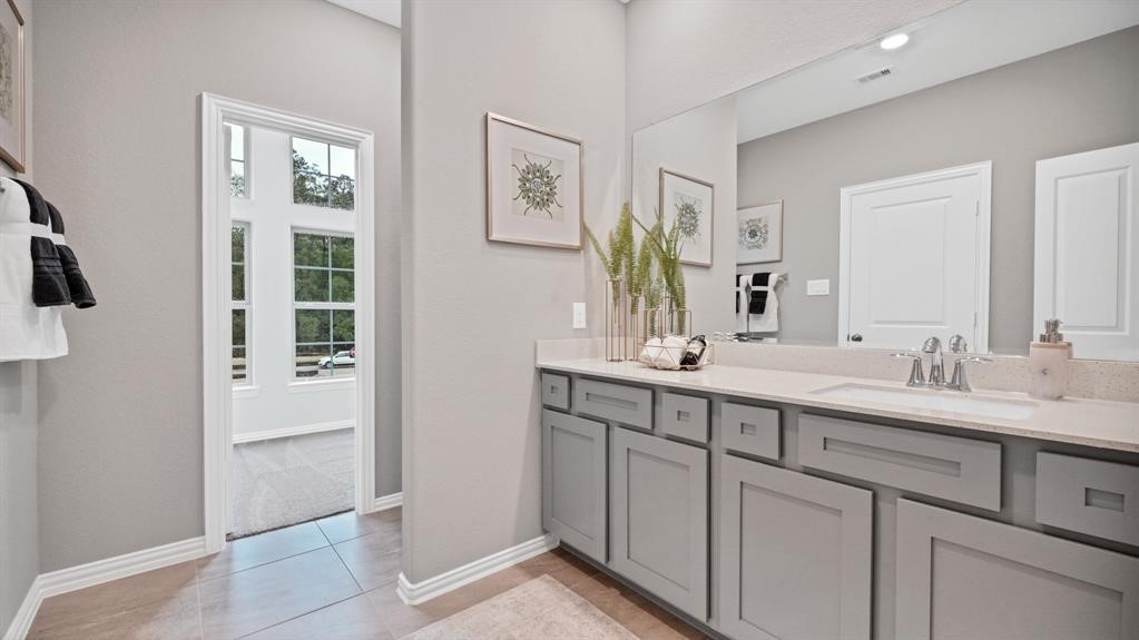 542 Dry Fork Lane Conroe, TX 77304 - Photo 6 of 9 a bathroom with a double vanity sink and mirror