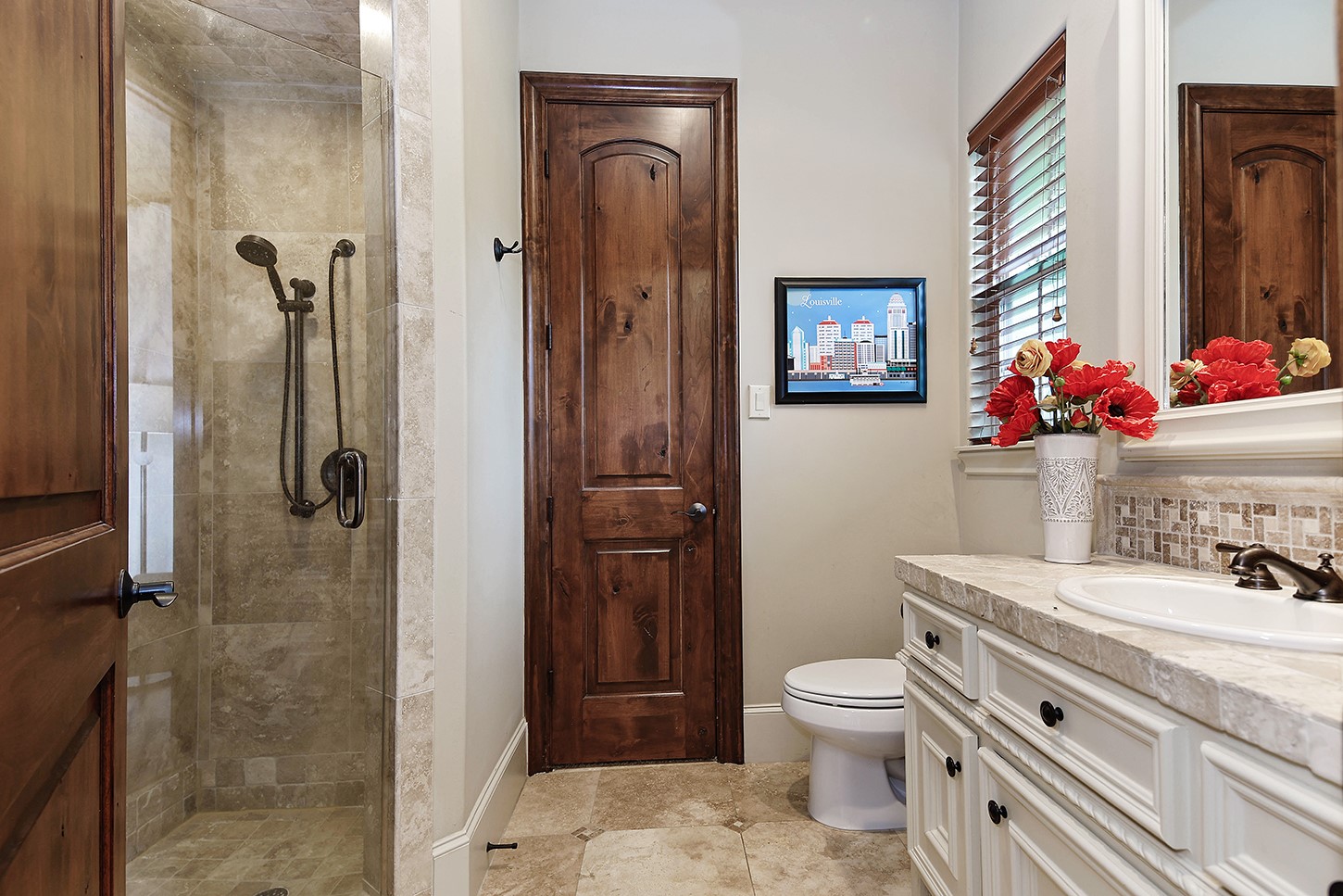 119 Angel Leaf Road The Woodlands, TX 77380 - Photo 34 of 50 a bathroom with a granite countertop toilet sink and shower