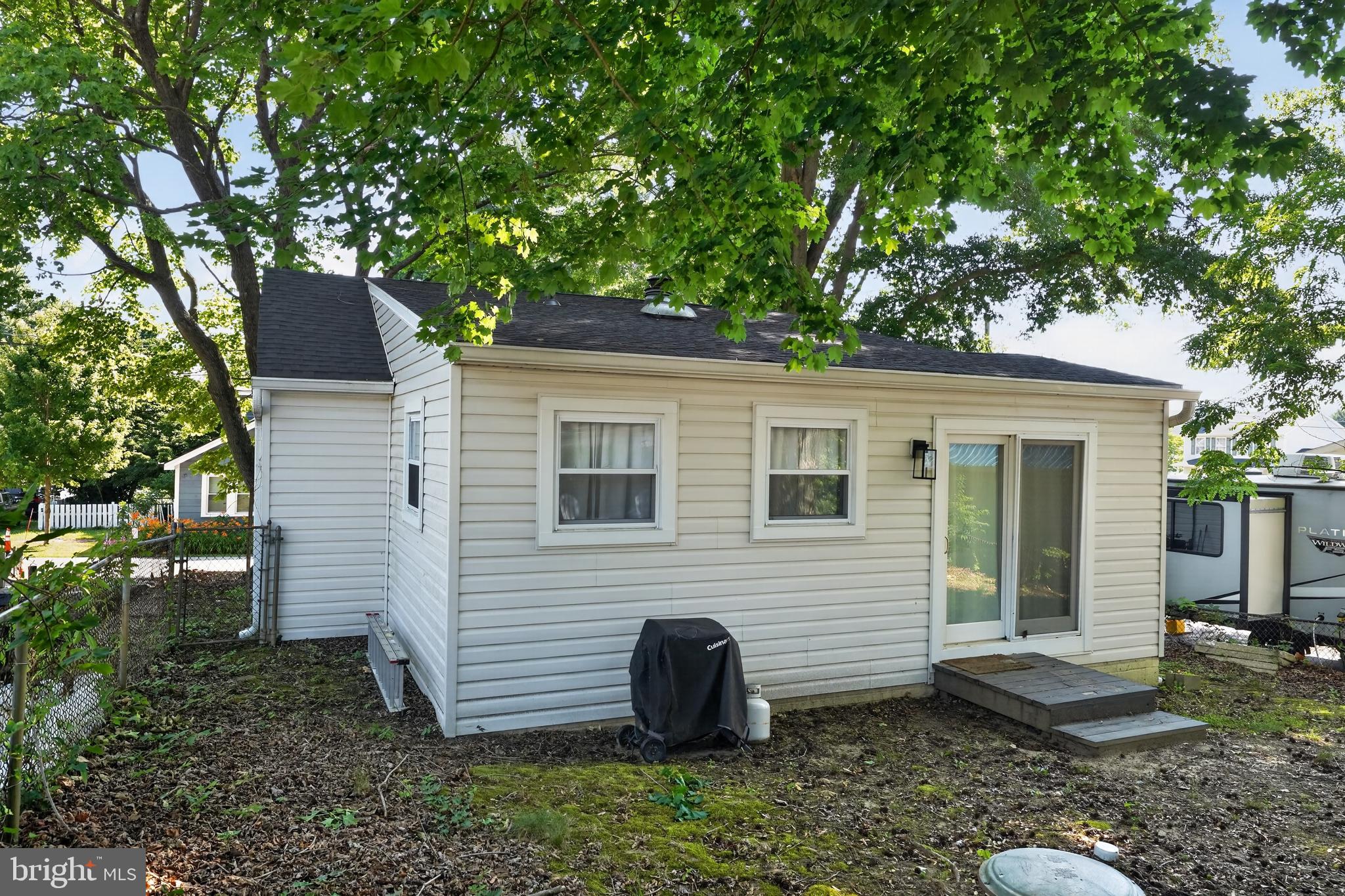 3670 5th Avenue Edgewater, MD 21037 - Photo 19 of 60 a view of a small house with a yard