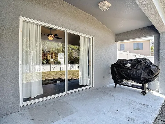 a swimming pool with yard and outdoor seating