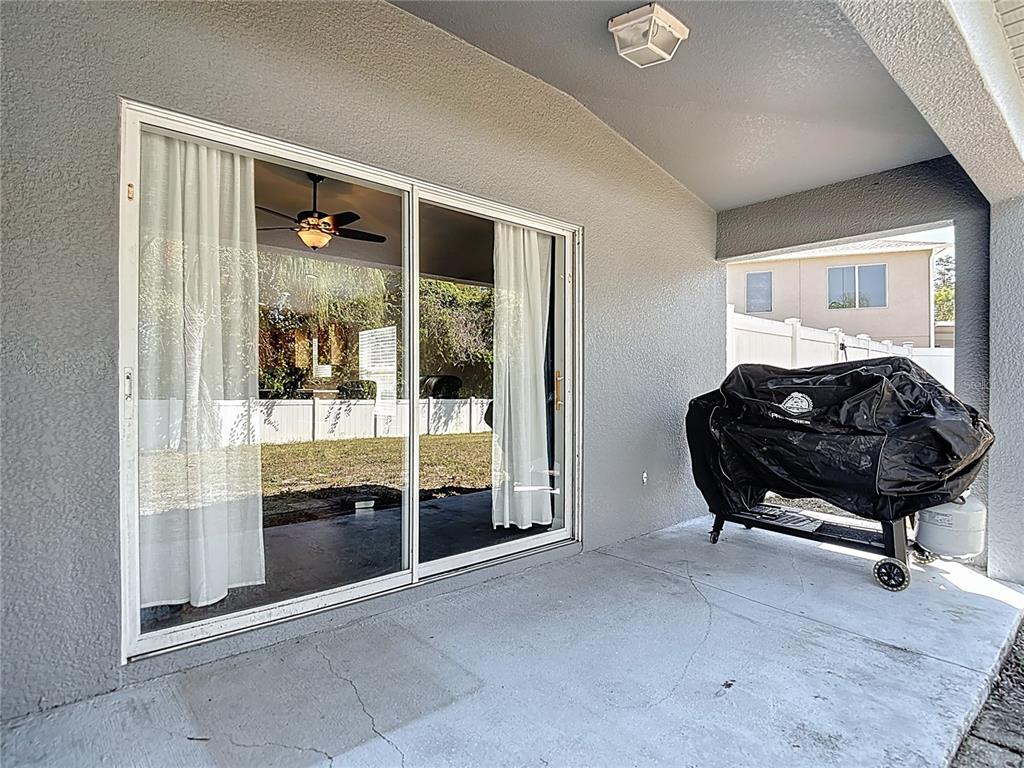 12153 South Bridge Terrace Hudson, FL 34669 - Photo 15 of 60 a room with furniture and a glass door