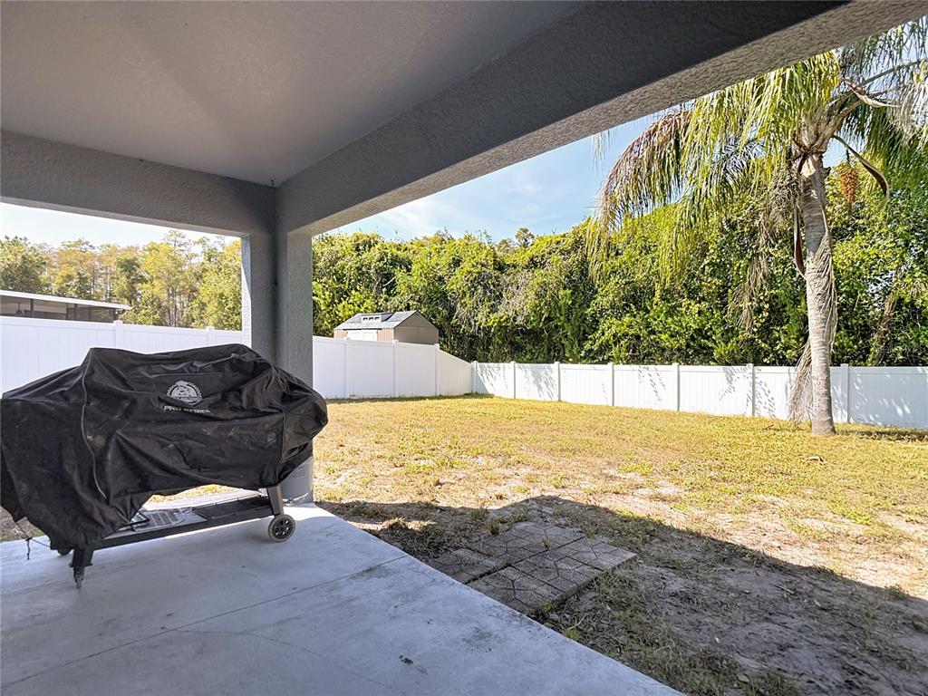 12153 South Bridge Terrace Hudson, FL 34669 - Photo 22 of 60 a view of a swimming pool with an outdoor seating
