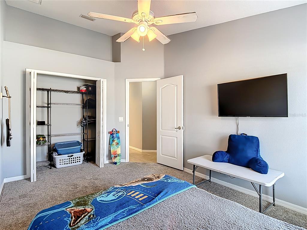 12153 South Bridge Terrace Hudson, FL 34669 - Photo 23 of 60 a living room with furniture and a flat screen tv