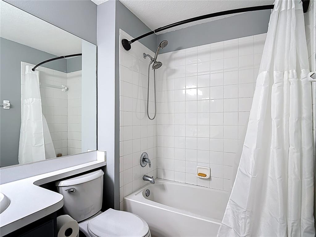 12153 South Bridge Terrace Hudson, FL 34669 - Photo 28 of 60 a bathroom with a sink toilet and shower