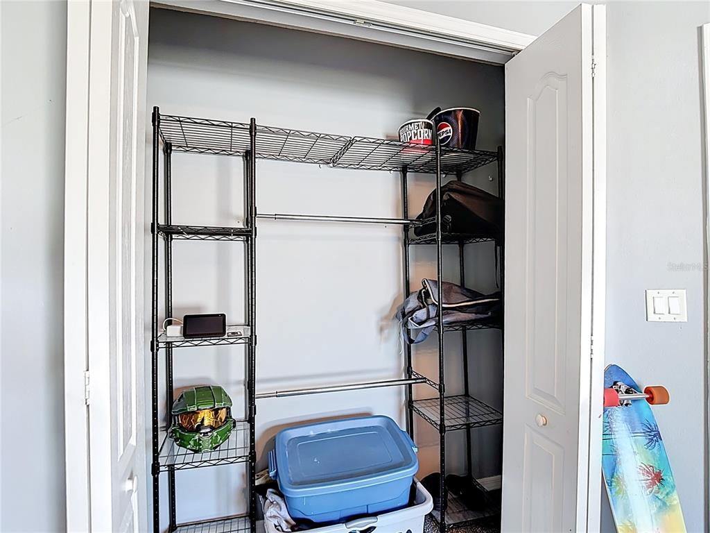12153 South Bridge Terrace Hudson, FL 34669 - Photo 29 of 60 a view of walk in closet with clothes and shoes