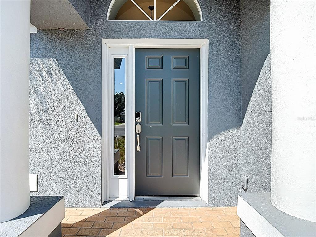 12153 South Bridge Terrace Hudson, FL 34669 - Photo 3 of 60 a view of bedroom with a bed and wooden floor