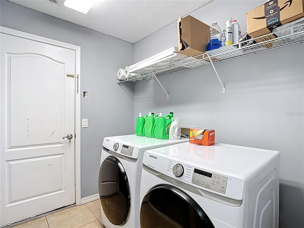 12153 South Bridge Terrace Hudson, FL 34669 - Photo 38 of 60 a utility room with dryer and washer
