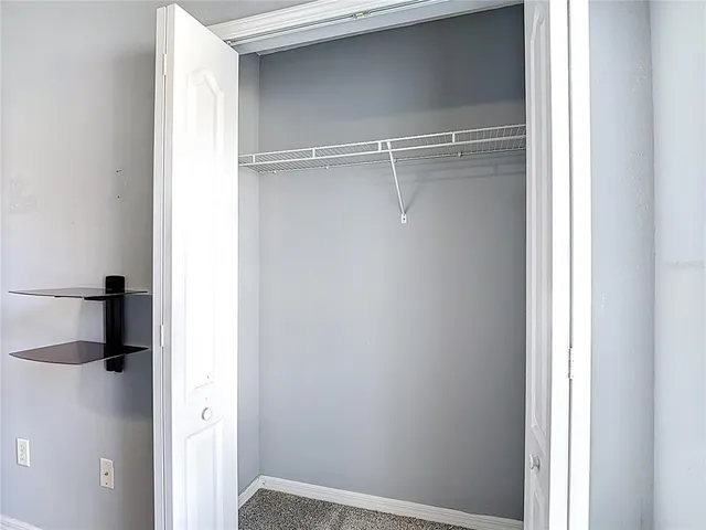 a bathroom with a glass shower door and a shower