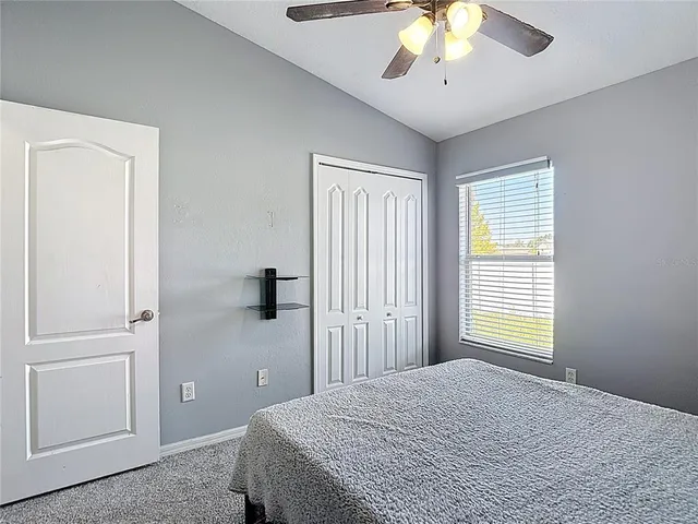 a kitchen with stainless steel appliances kitchen island granite countertop a dining table chairs and granite counter tops