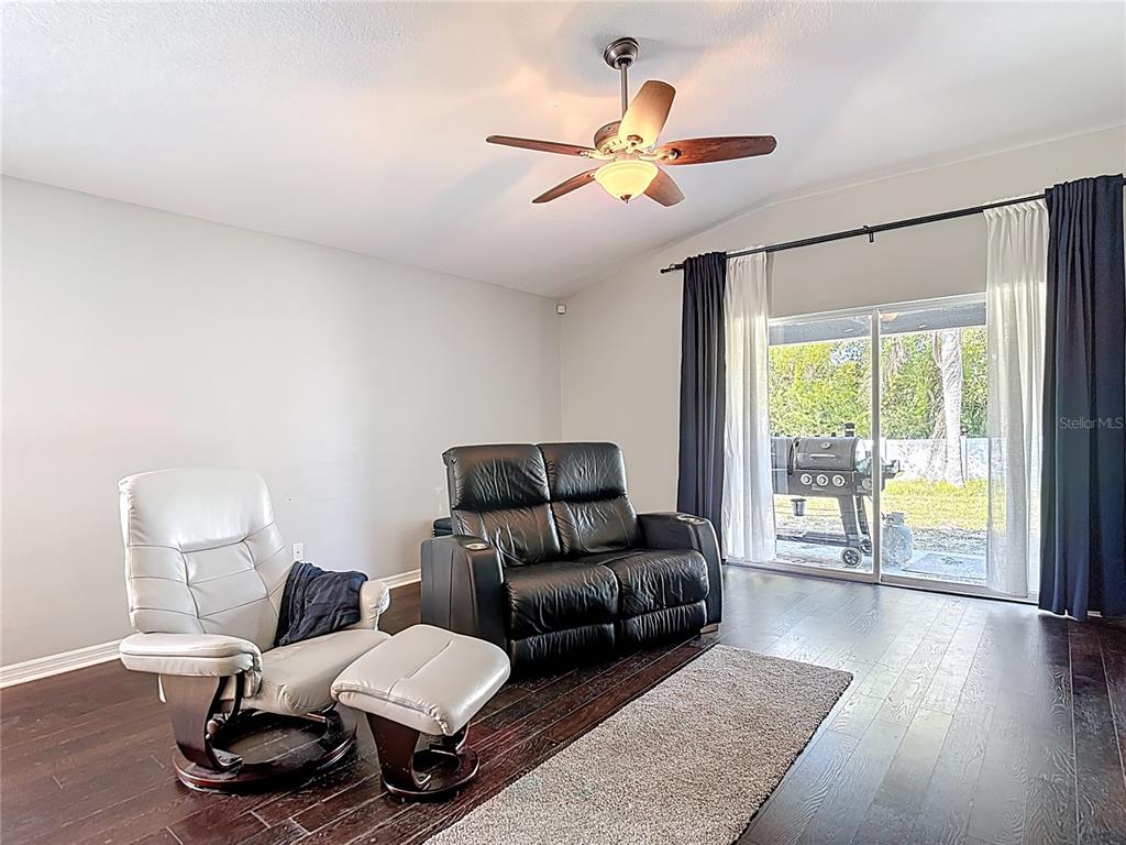 12153 South Bridge Terrace Hudson, FL 34669 - Photo 49 of 60 a living room with furniture and a large window