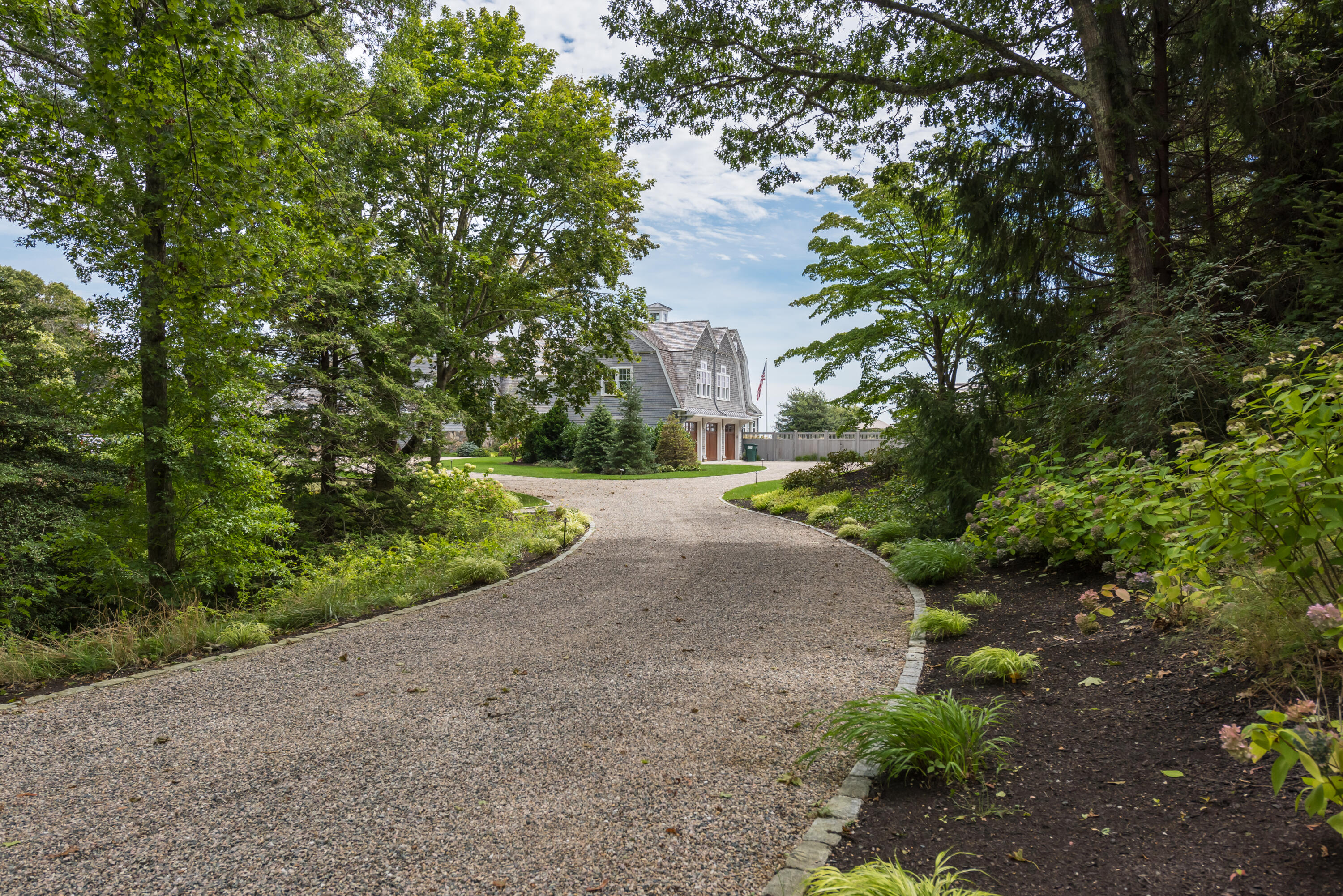 159 Main Street Osterville, MA 02655 - Photo 14 of 56 a view of a yard with plants and trees