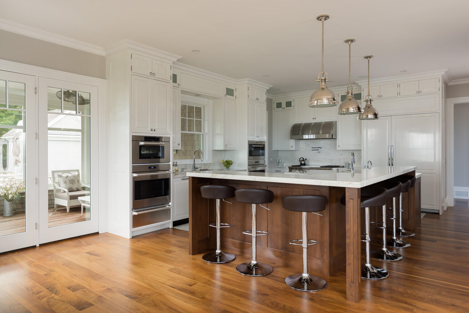 159 Main Street Osterville, MA 02655 - Photo 27 of 56 a large kitchen with stainless steel appliances granite countertop a stove a sink dishwasher and a refrigerator with wooden floor