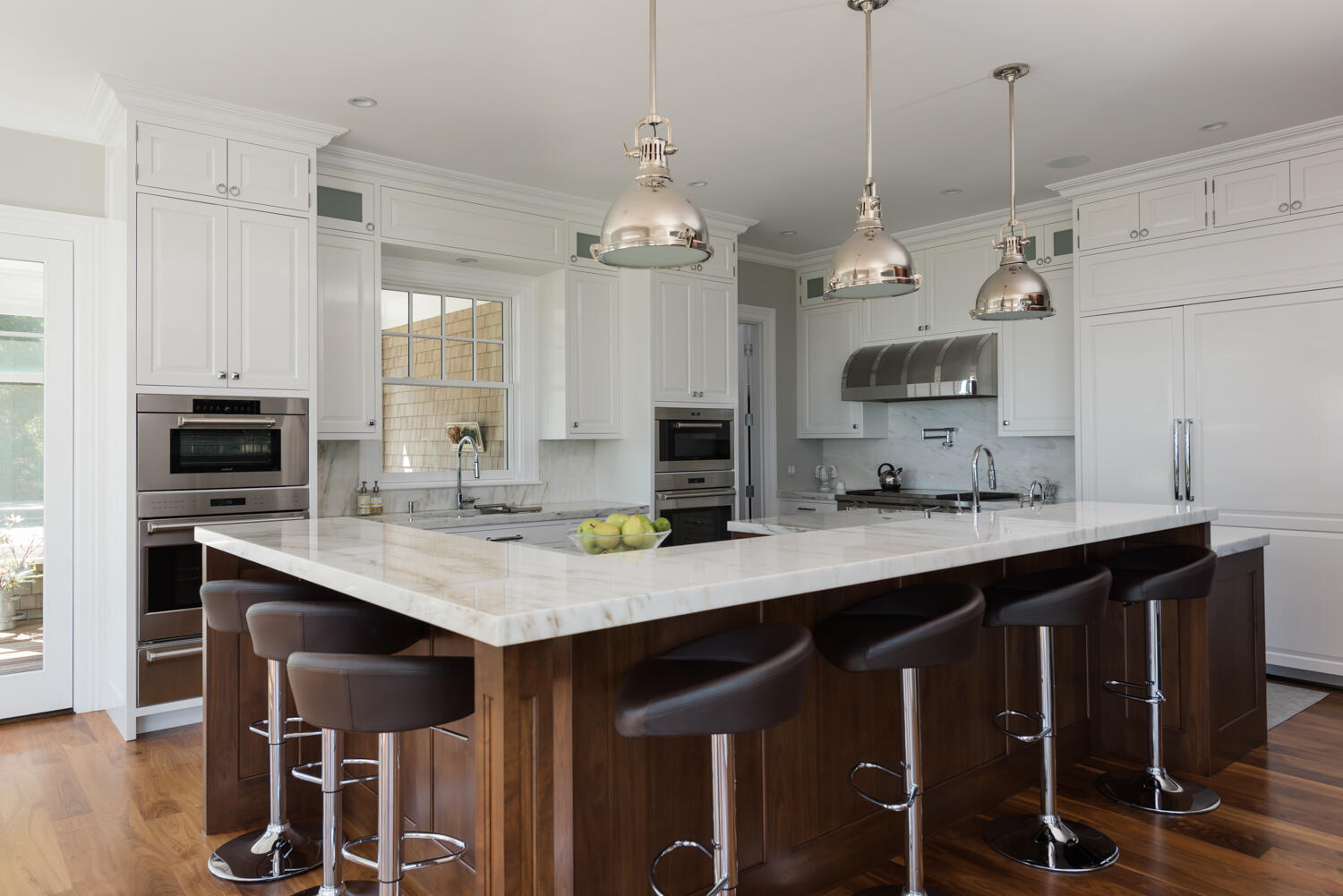 159 Main Street Osterville, MA 02655 - Photo 28 of 56 a kitchen with kitchen island granite countertop a sink a center island and cabinets