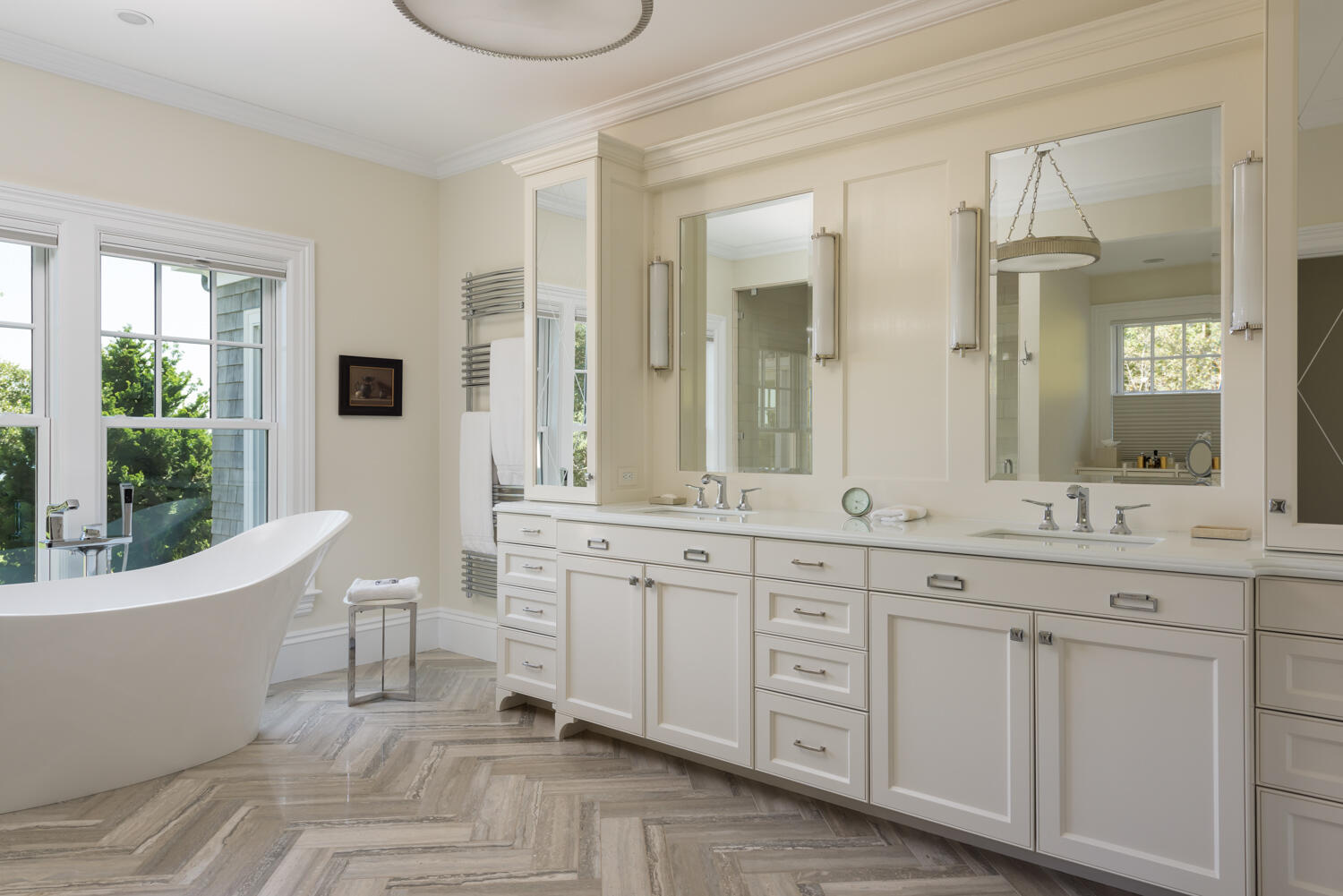 159 Main Street Osterville, MA 02655 - Photo 35 of 56 a spacious bathroom with a double vanity sink a mirror a bathtub and next to a window