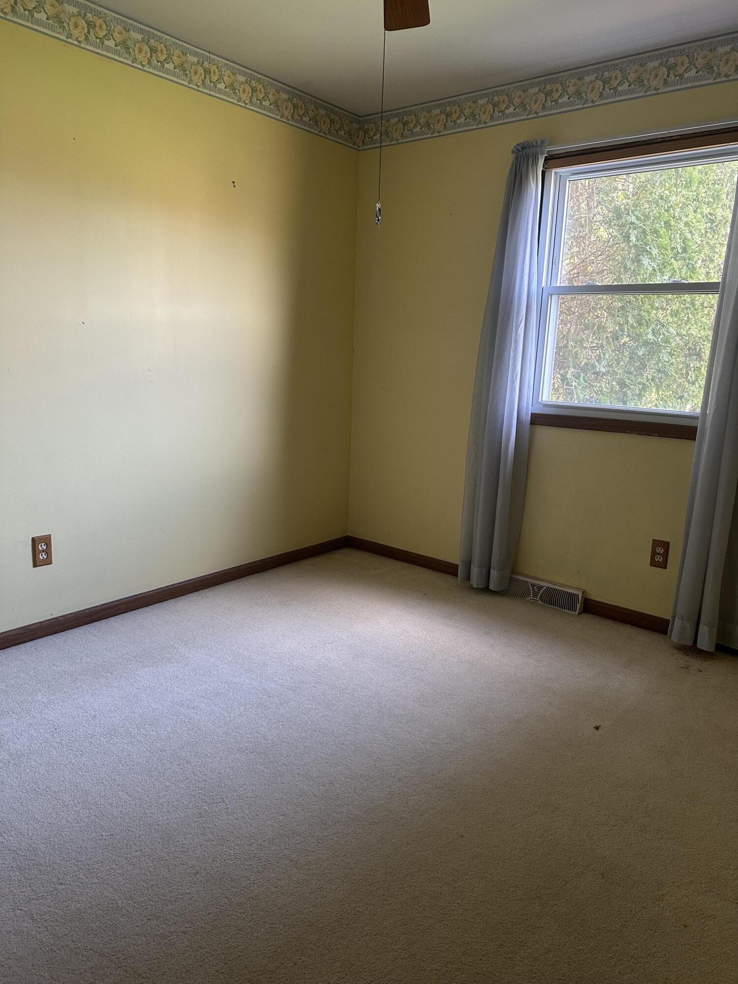 67 Brookview Lane Valparaiso, IN 46385 - Photo 2 of 16 an empty room with a window