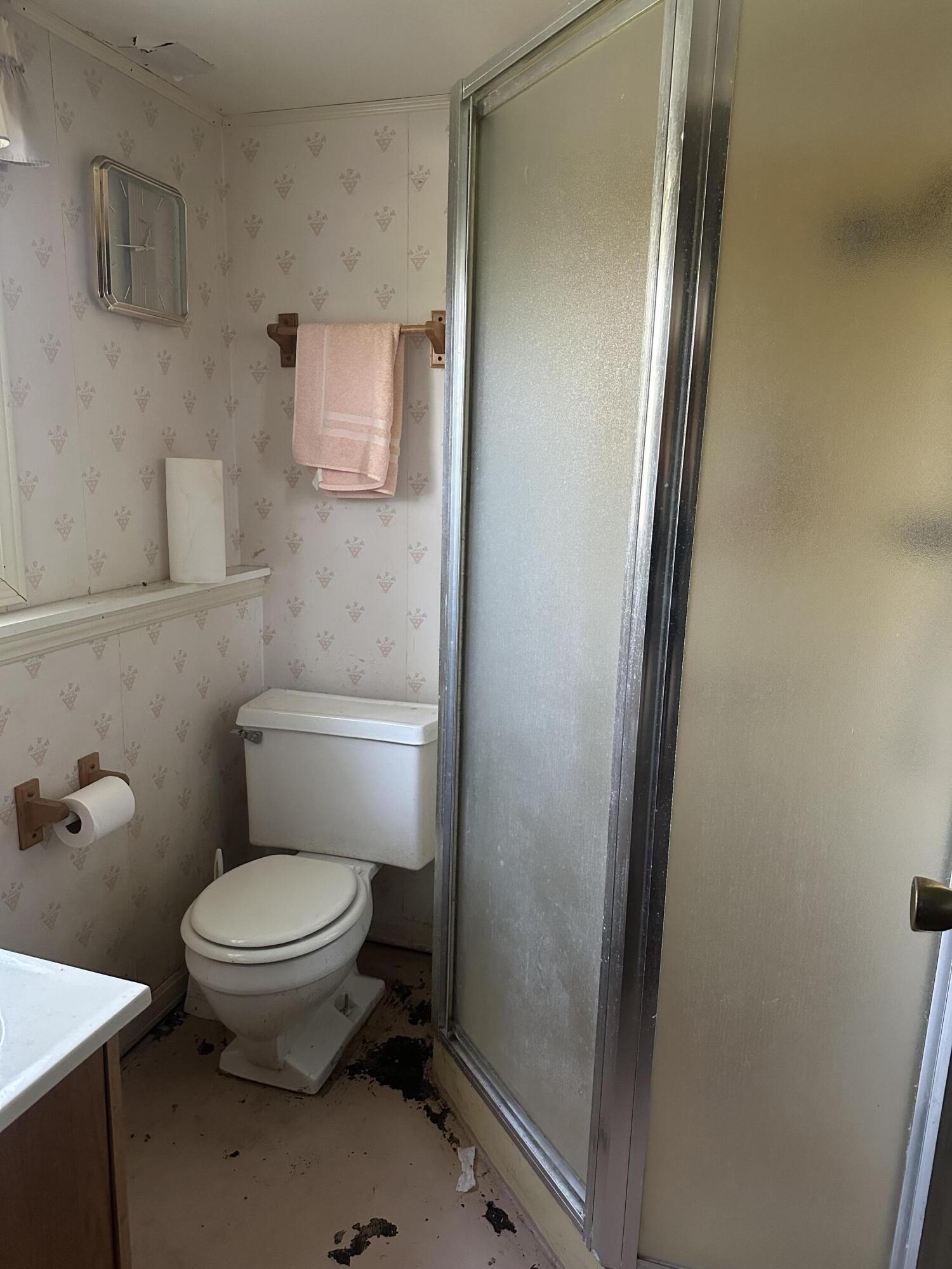 67 Brookview Lane Valparaiso, IN 46385 - Photo 7 of 16 a white toilet sitting next to a bathroom sink
