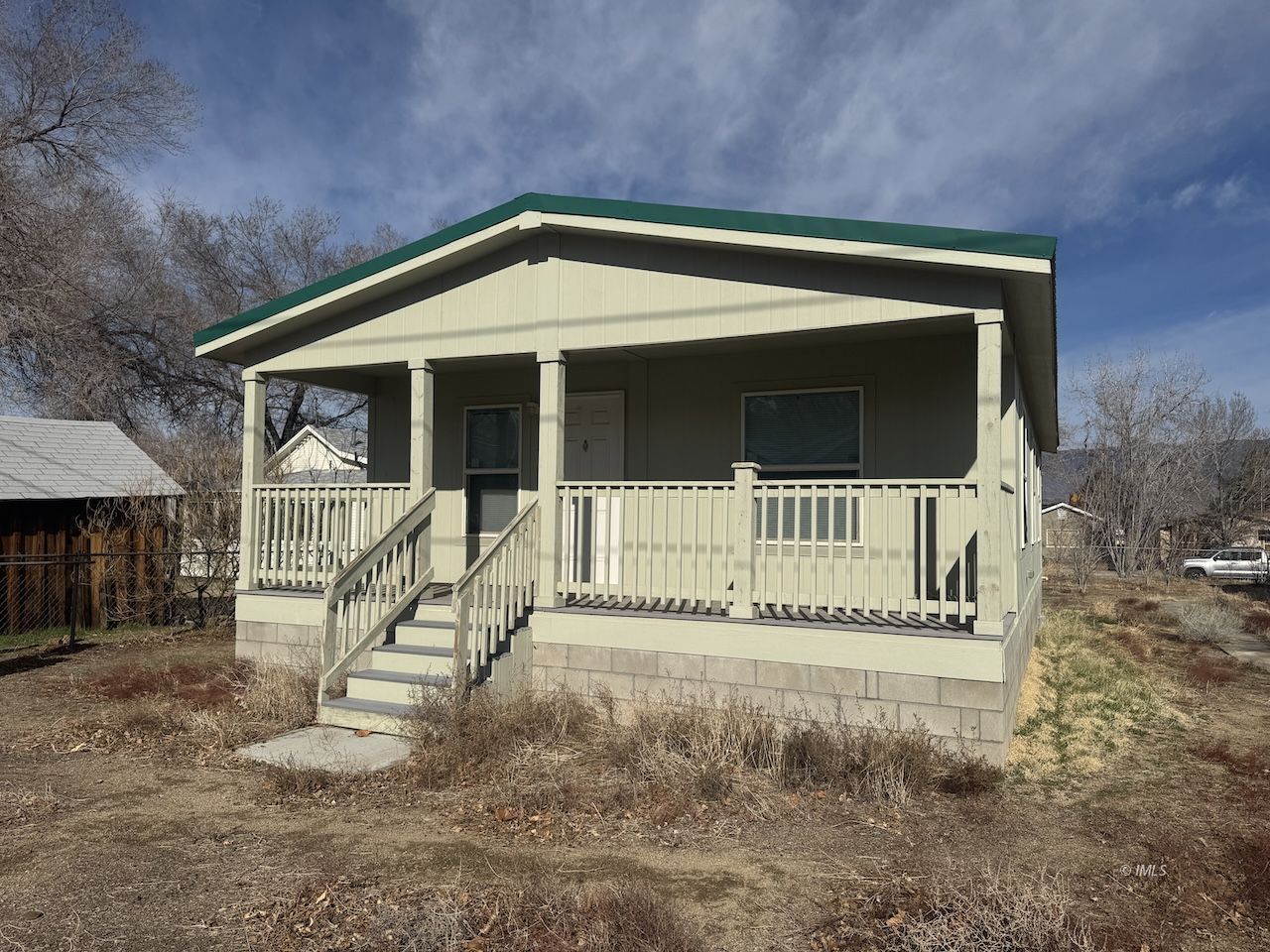 427 North Jackson Street Independence, CA 93526 - Photo 1 of 21 a front view of a house with a yard