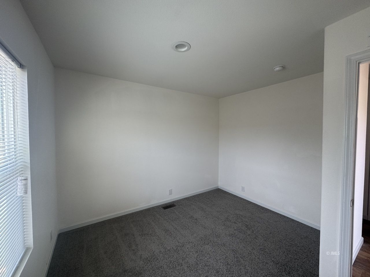 427 North Jackson Street Independence, CA 93526 - Photo 13 of 21 an empty room with a window