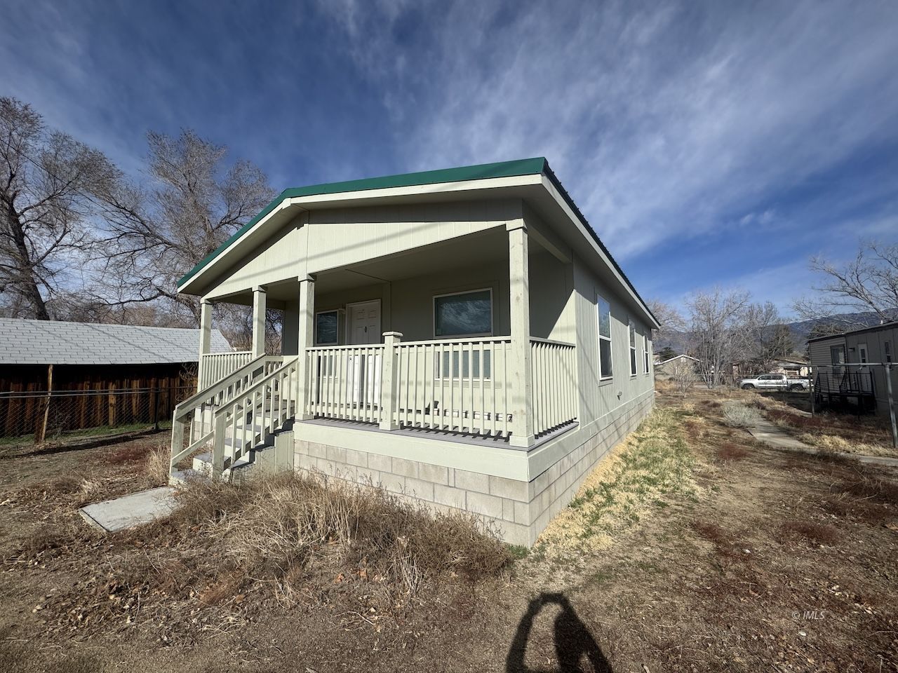 427 North Jackson Street Independence, CA 93526 - Photo 2 of 21 a front view of a house with a yard