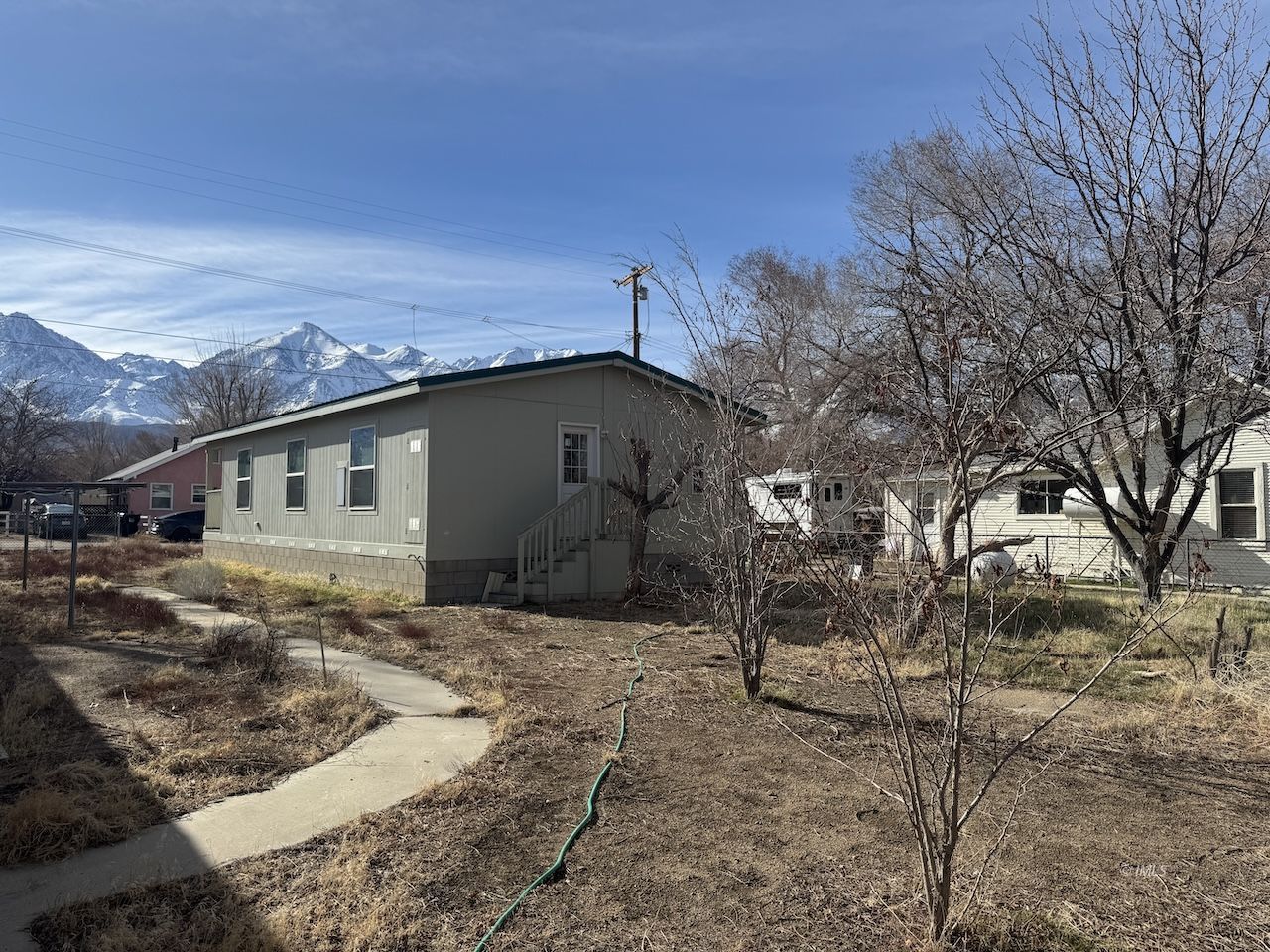 427 North Jackson Street Independence, CA 93526 - Photo 21 of 21 a backyard of a house with large trees
