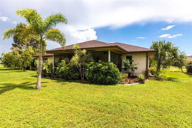 an aerial view of multiple houses with yard