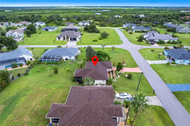 an aerial view of a house with a garden