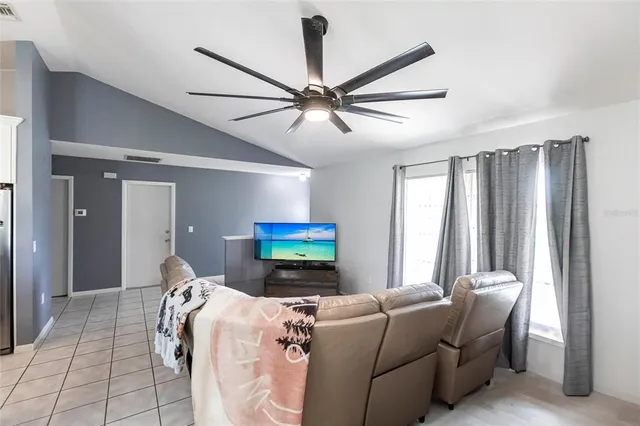 a living room with furniture and a window