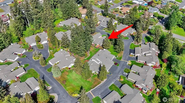 an aerial view of residential houses with outdoor space