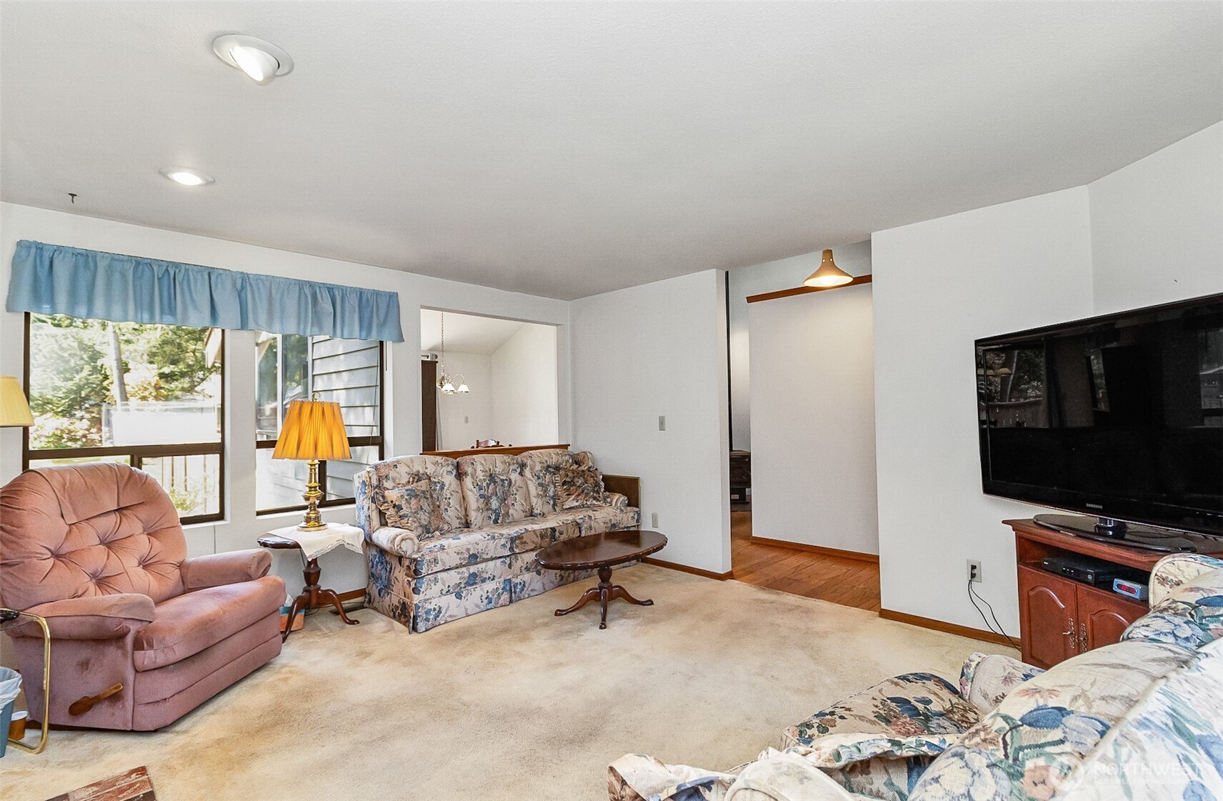 1324 Boise Street Fircrest, WA 98466 - Photo 16 of 39 a living room with furniture and a flat screen tv
