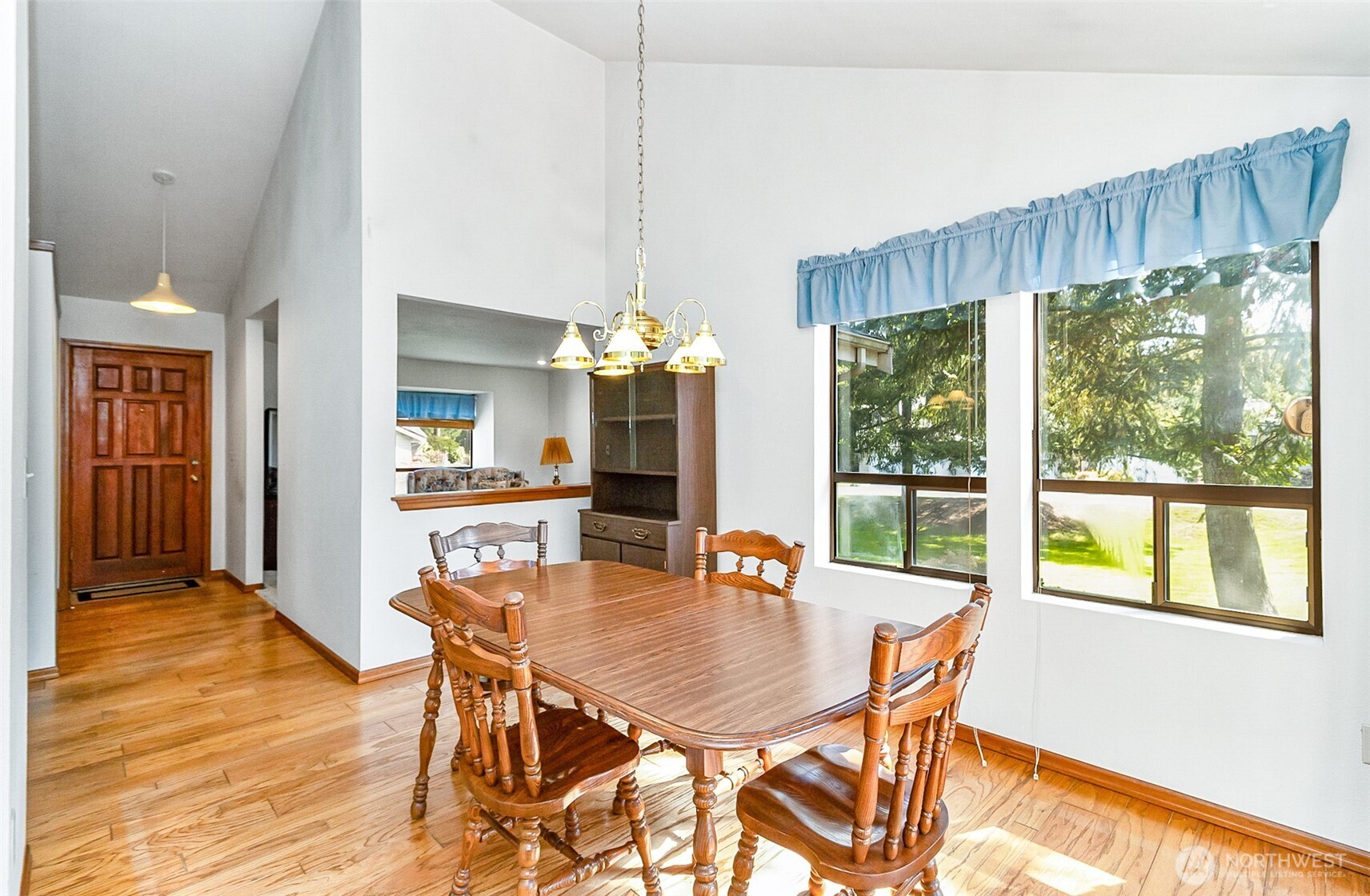 1324 Boise Street Fircrest, WA 98466 - Photo 17 of 39 a dining room with furniture a chandelier and wooden floor
