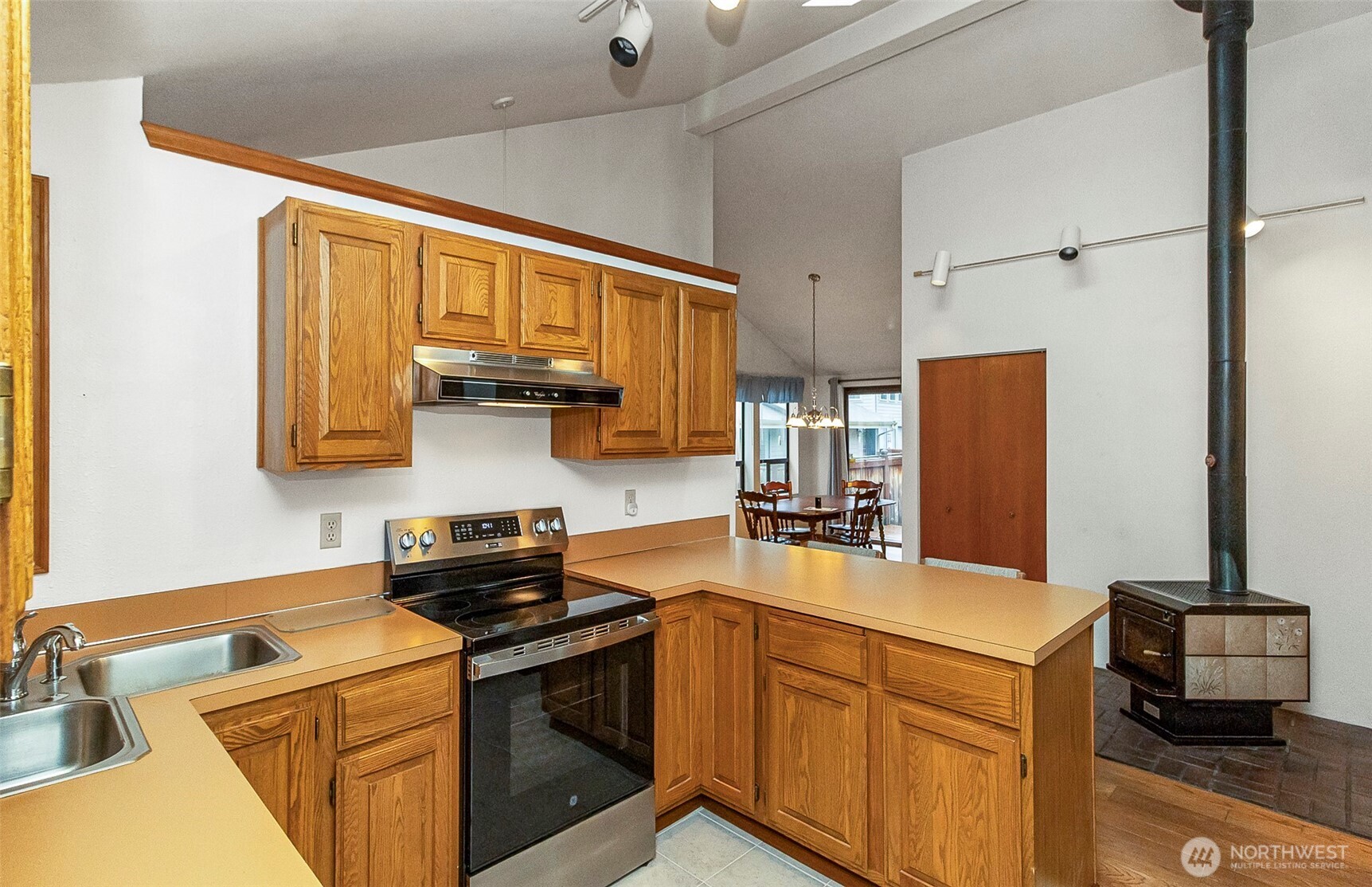 1324 Boise Street Fircrest, WA 98466 - Photo 23 of 39 a kitchen with stainless steel appliances granite countertop a sink stove and refrigerator