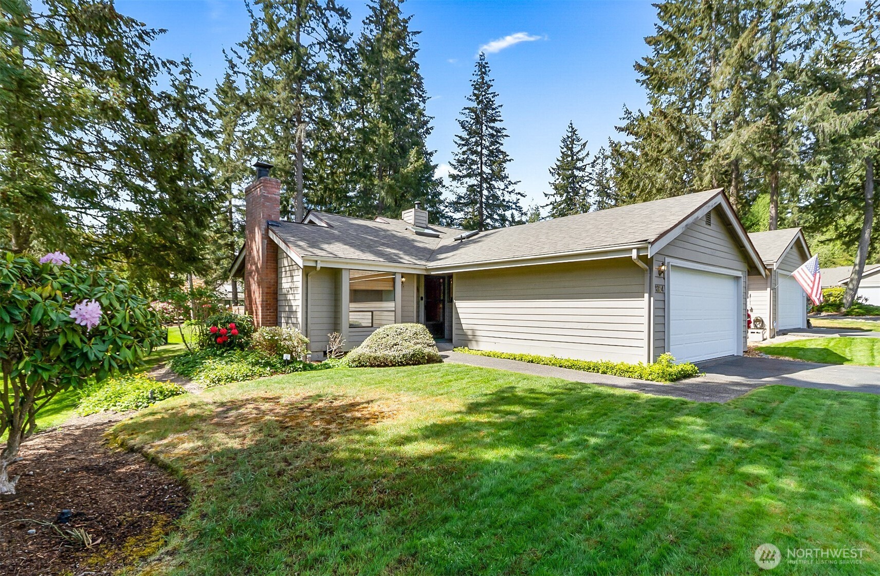1324 Boise Street Fircrest, WA 98466 - Photo 3 of 39 a view of a house with a yard and lawn chairs with wooden fence